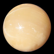 Topaz Honey Calcite sphere 63mm 341g in sunlight - Rocks and Things Store