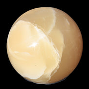 Topaz Honey Calcite sphere 63mm 341g in sunlight - Rocks and Things Store