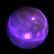 Honey Calcite sphere 48mm 175g in UV light  - Rocks and Things Store