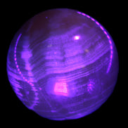 Honey Calcite sphere 48mm 175g in UV light  - Rocks and Things Store