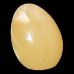 Honey Calcite Egg 47*72mm 252.4g in sunlight - Rocks and Things Store