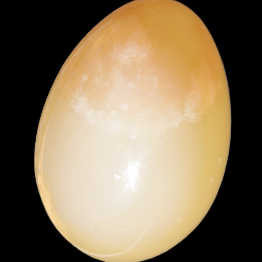 Honey Calcite Egg 47*72mm 252.4g in sunlight - Rocks and Things Store