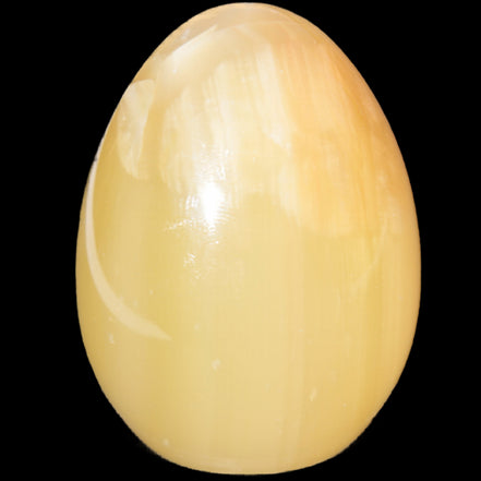 Honey Calcite Egg 47*72mm 252.4g in sunlight - Rocks and Things Store