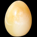 Honey Calcite Egg 47*72mm 252.4g in sunlight - Rocks and Things Store