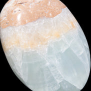 Pistachio Calcite palmstone 64-72mm  121-168g in sunshine - Rocks and Things Store