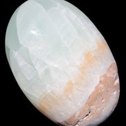 Pistachio Calcite palmstone 64-72mm  121-168g in sunshine - Rocks and Things Store