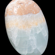 Pistachio Calcite palmstone 64-72mm  121-168g in sunshine - Rocks and Things Store
