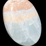 Pistachio Calcite palmstone 64-72mm  121-168g in sunshine - Rocks and Things Store