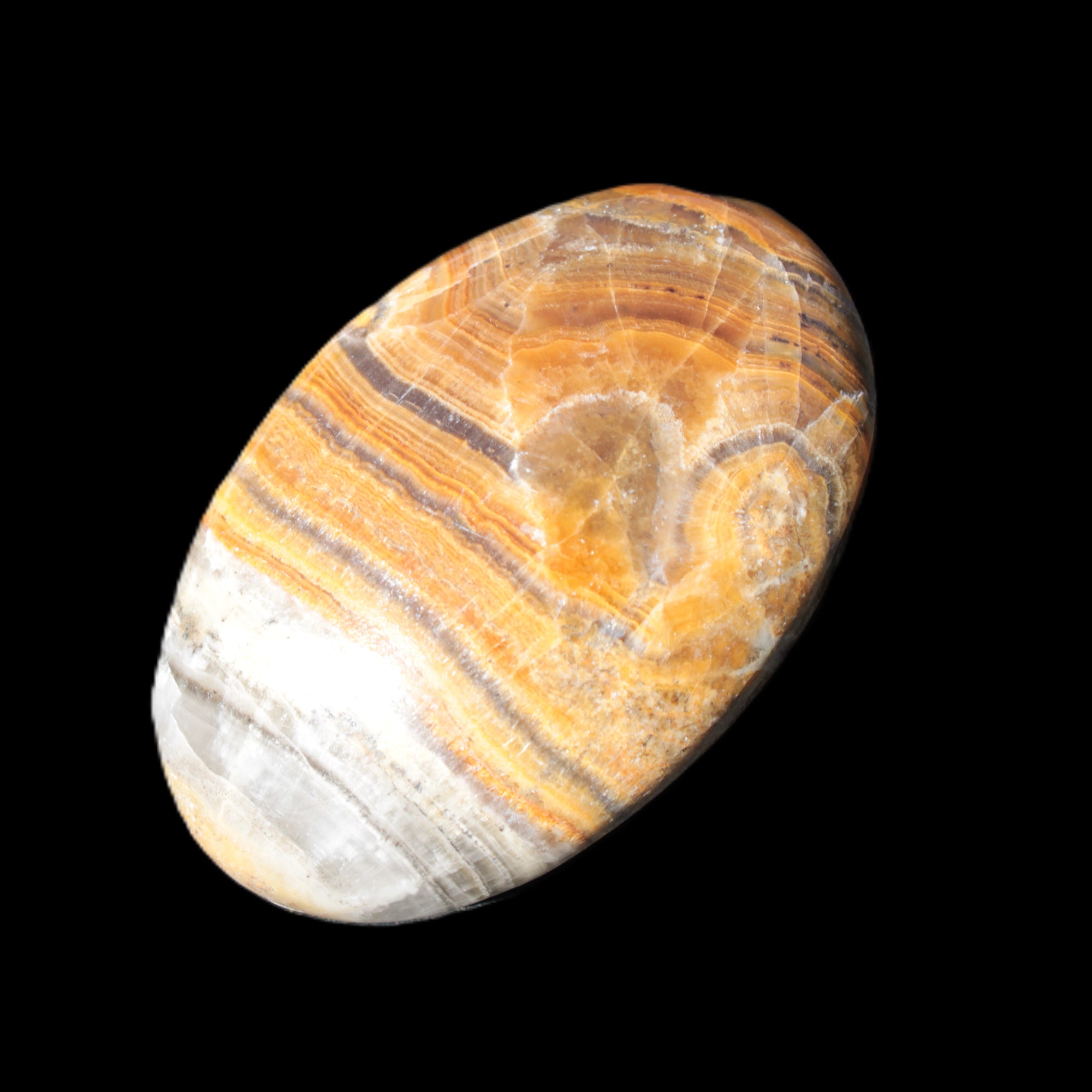BumbleBee Calcite palm stone 64-70mm 108-130g  in sunlight - Rocks and Things Store