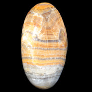 BumbleBee Calcite palm stone 64-70mm 108-130g in sunlight - Rocks and Things Store