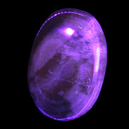 BumbleBee Calcite palm stone 64-70mm 108-130g in UV light - Rocks and Things Store