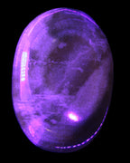 BumbleBee Calcite palm stone 64-70mm 108-130g in UV light - Rocks and Things Store