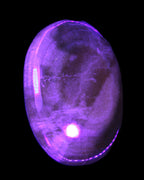 BumbleBee Calcite palm stone 64-70mm 108-130g in UV light - Rocks and Things Store