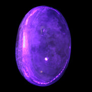 BumbleBee Calcite palm stone 64-70mm 108-130g in UV light - Rocks and Things Store