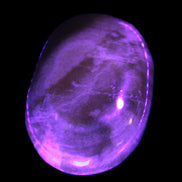 BumbleBee Calcite palm stone 64-70mm 108-130g in UV light - Rocks and Things Store