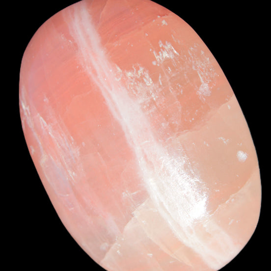 Pink Sorbet Calcite palm stone 57-61mm 71-117g in sunlight - Rocks and Things Store