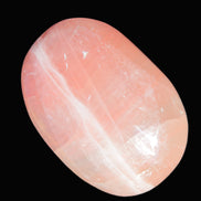 Pink Sorbet Calcite palm stone 57-61mm 71-117g in sunlight - Rocks and Things Store