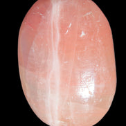 Pink Sorbet Calcite palm stone 57-61mm 71-117g in sunlight - Rocks and Things Store