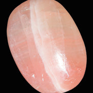 Pink Sorbet Calcite palm stone 57-61mm 71-117g in sunlight - Rocks and Things Store