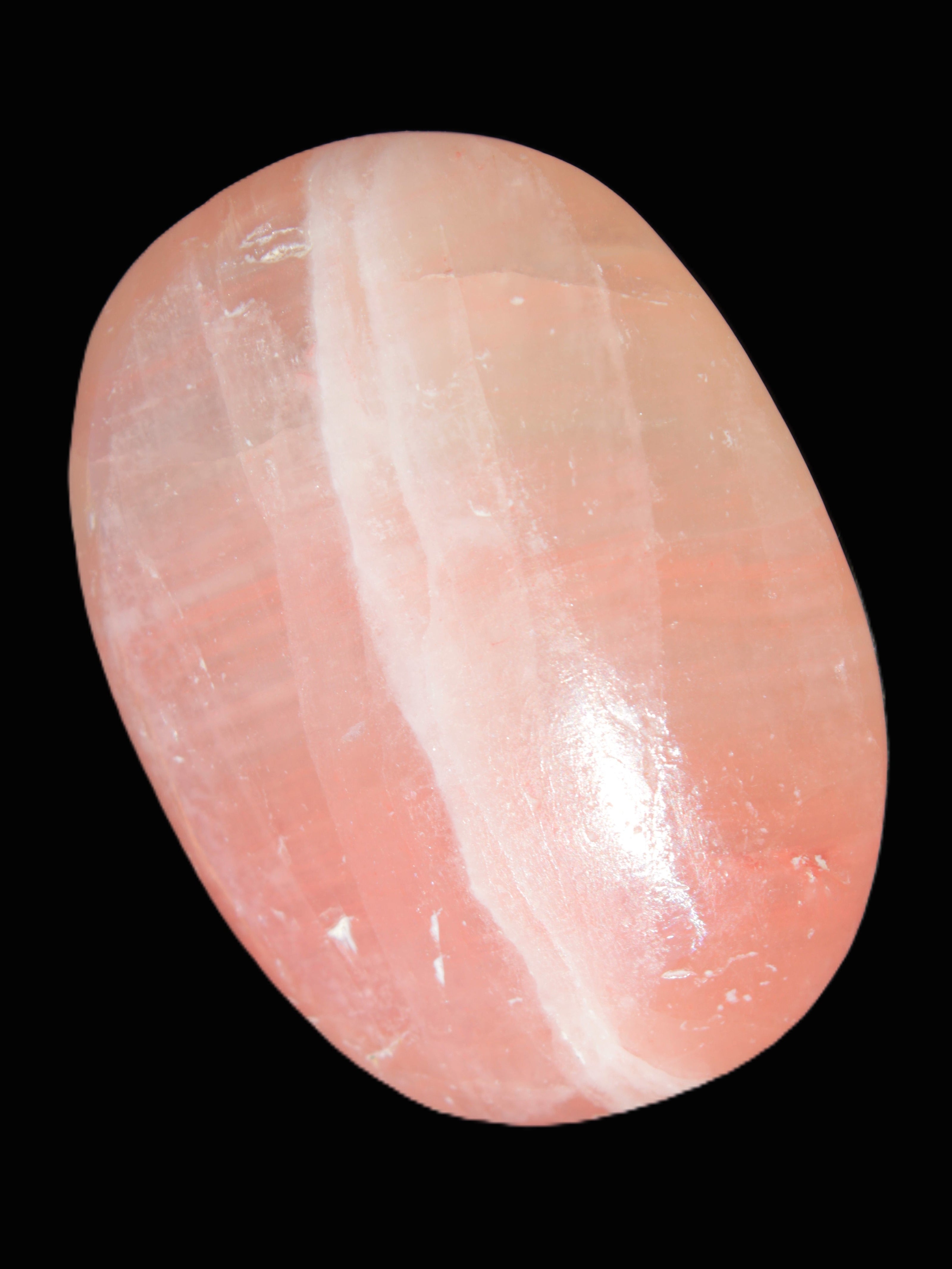 Pink Sorbet Calcite palm stone 57-61mm 71-117g in sunlight - Rocks and Things Store