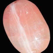 Pink Sorbet Calcite palm stone 57-61mm 71-117g in sunlight - Rocks and Things Store