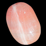 Pink Sorbet Calcite palm stone 57-61mm 71-117g in sunlight - Rocks and Things Store