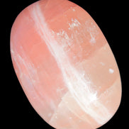 Pink Sorbet Calcite palm stone 57-61mm 71-117g in sunlight - Rocks and Things Store