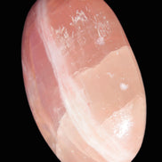 Pink Sorbet Calcite palm stone 57-61mm 71-117g in sunlight - Rocks and Things Store