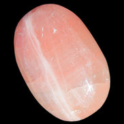 Pink Sorbet Calcite palm stone 57-61mm 71-117g in sunlight - Rocks and Things Store