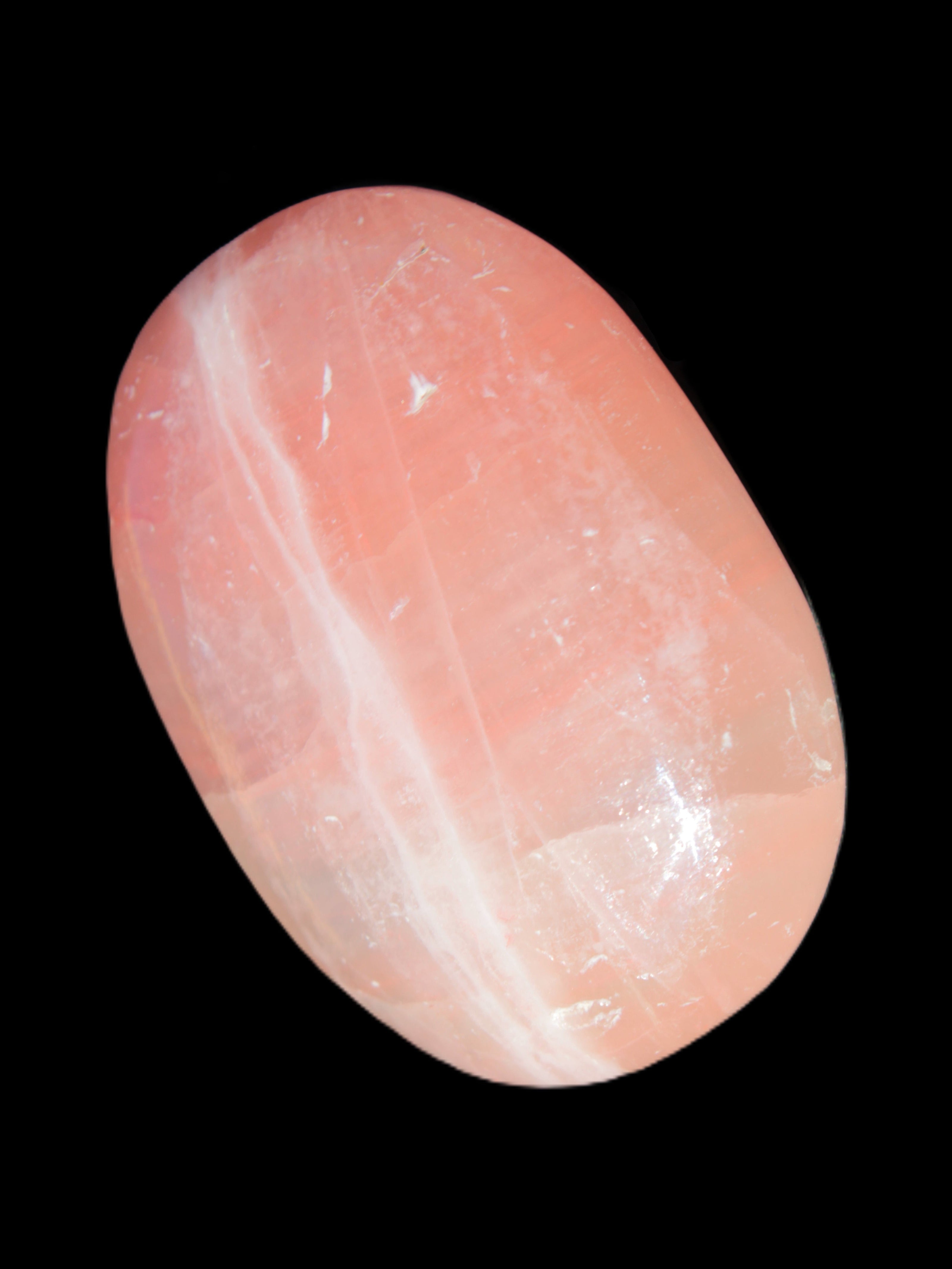 Pink Sorbet Calcite palm stone 57-61mm 71-117g in sunlight - Rocks and Things Store