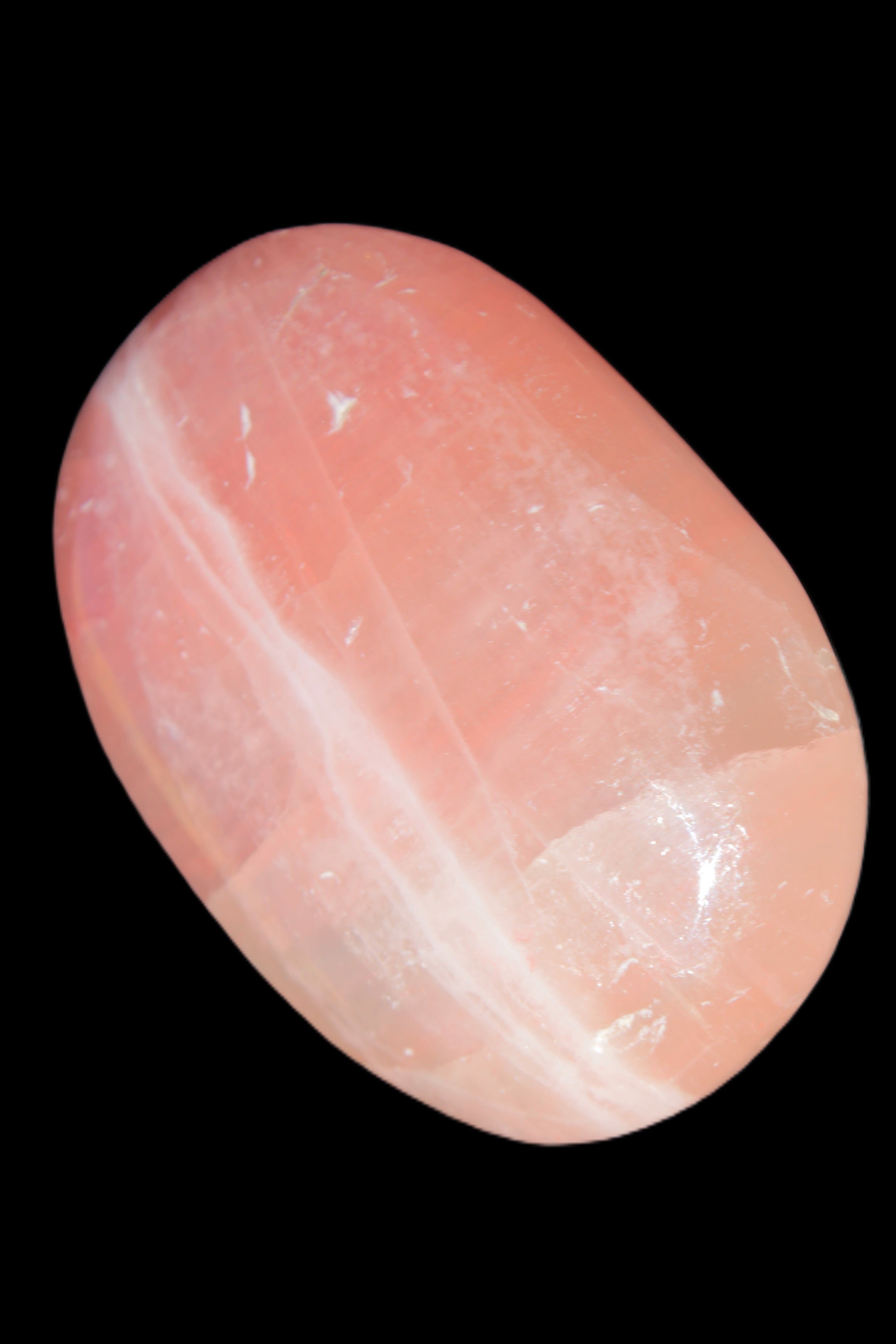 Pink Sorbet Calcite palm stone 57-61mm 71-117g in sunlight - Rocks and Things Store