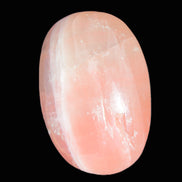 Pink Sorbet Calcite palm stone 57-61mm 71-117g in sunlight - Rocks and Things Store