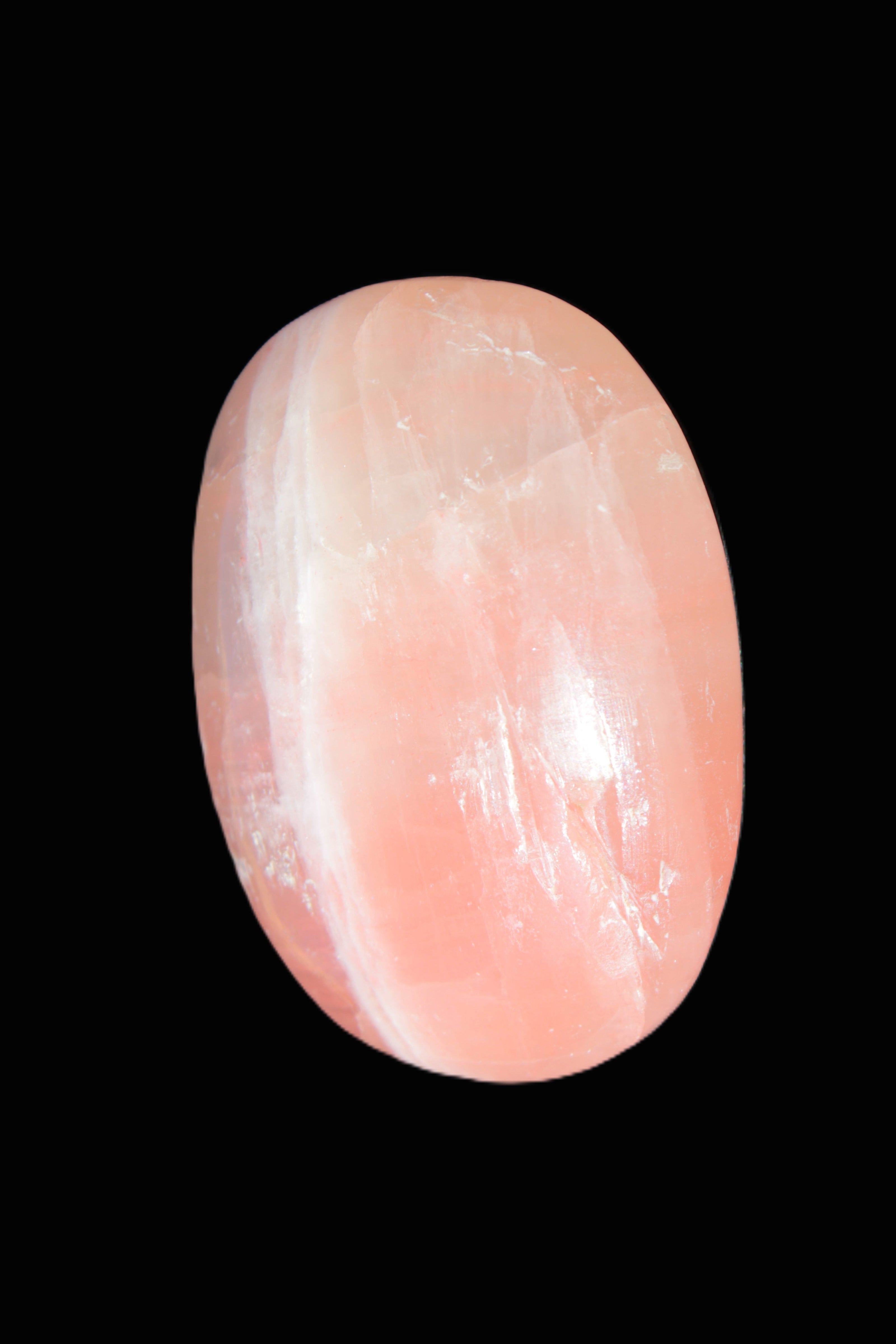 Pink Sorbet Calcite palm stone 57-61mm 71-117g in sunlight - Rocks and Things Store