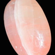 Pink Sorbet Calcite palm stone 57-61mm 71-117g in sunlight - Rocks and Things Store