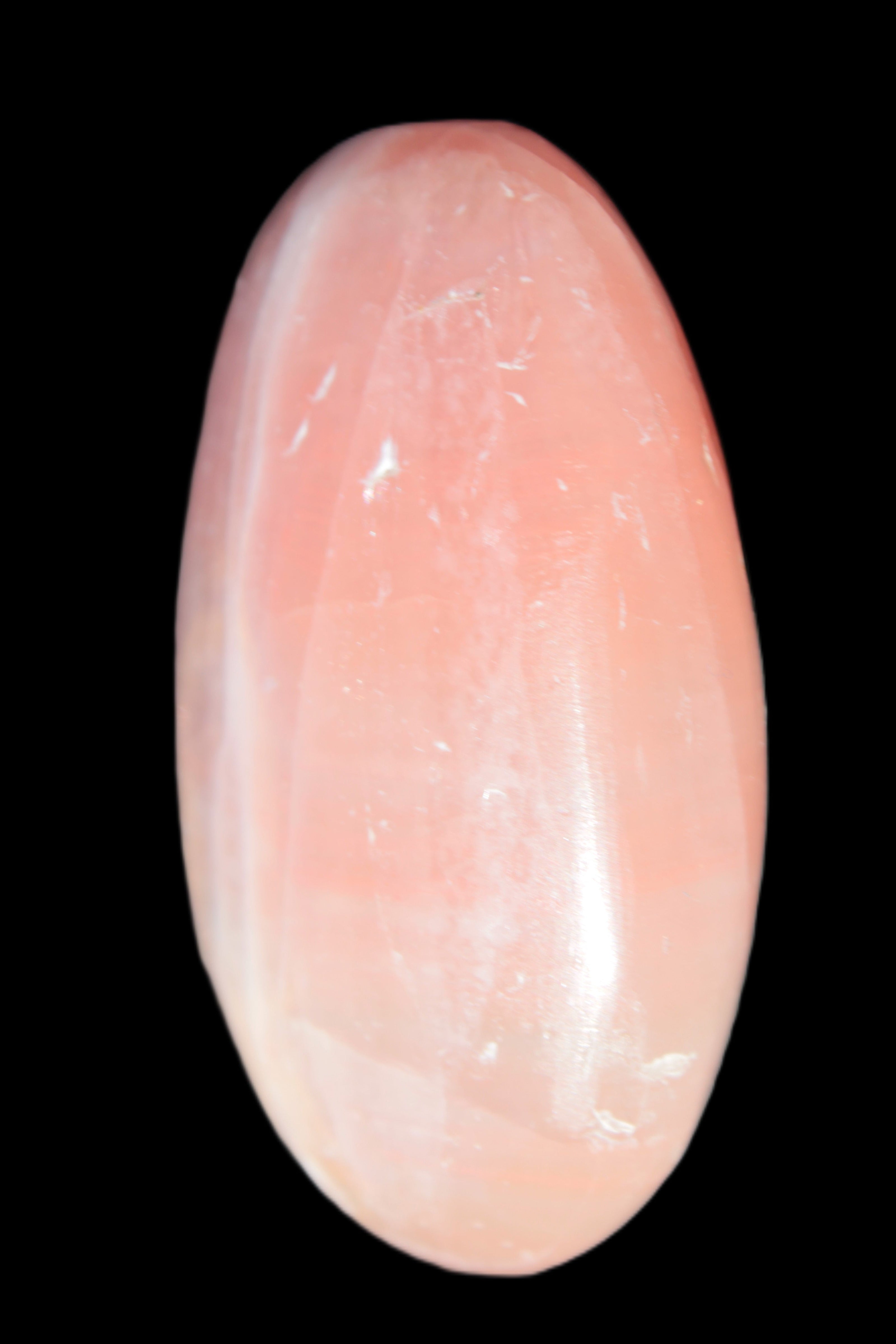 Pink Sorbet Calcite palm stone 57-61mm 71-117g in sunlight - Rocks and Things Store