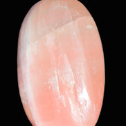 Pink Sorbet Calcite palm stone 57-61mm 71-117g in sunlight - Rocks and Things Store