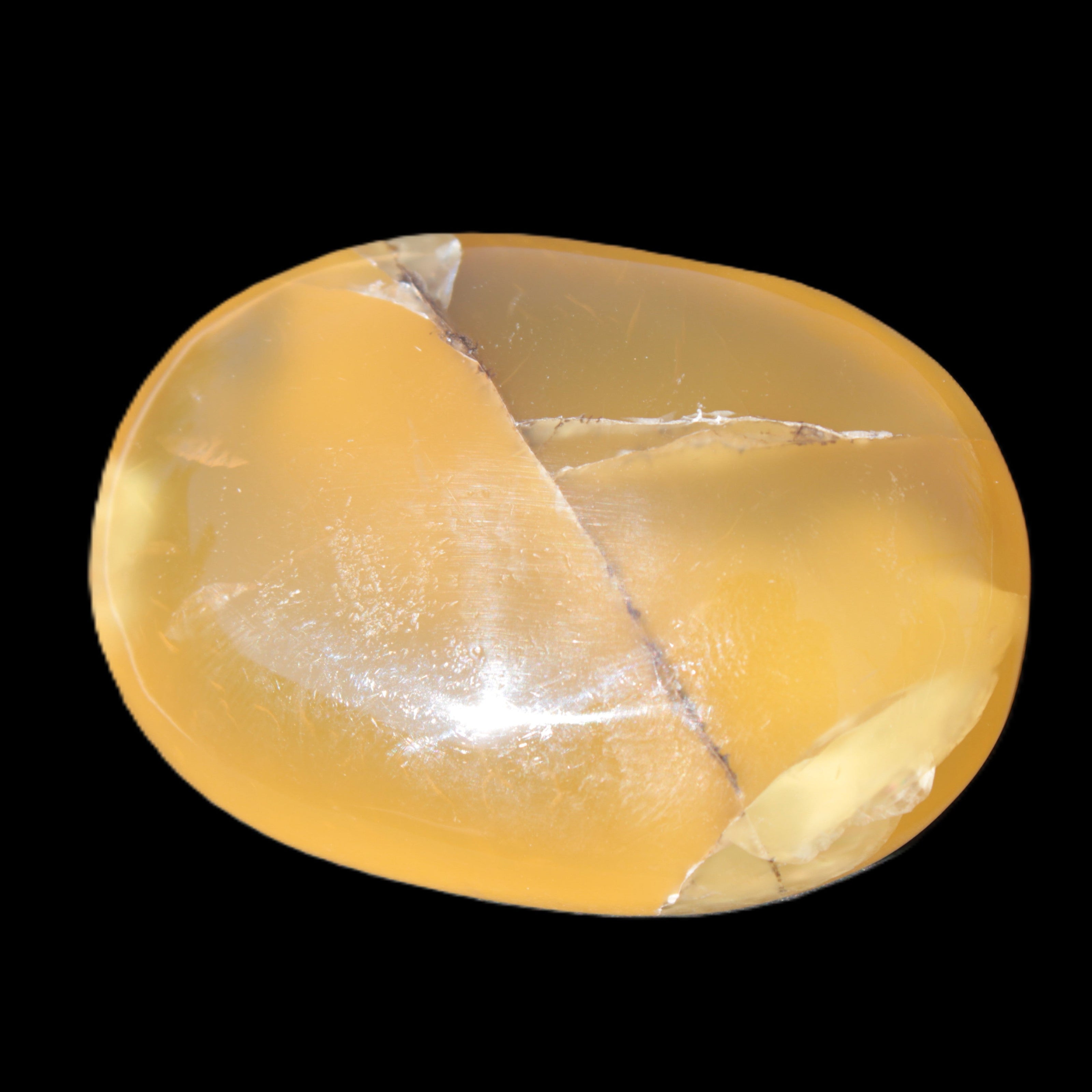 Honey Calcite palm stone 58-62mm 83-95g in sunlight - Rocks and Things Store