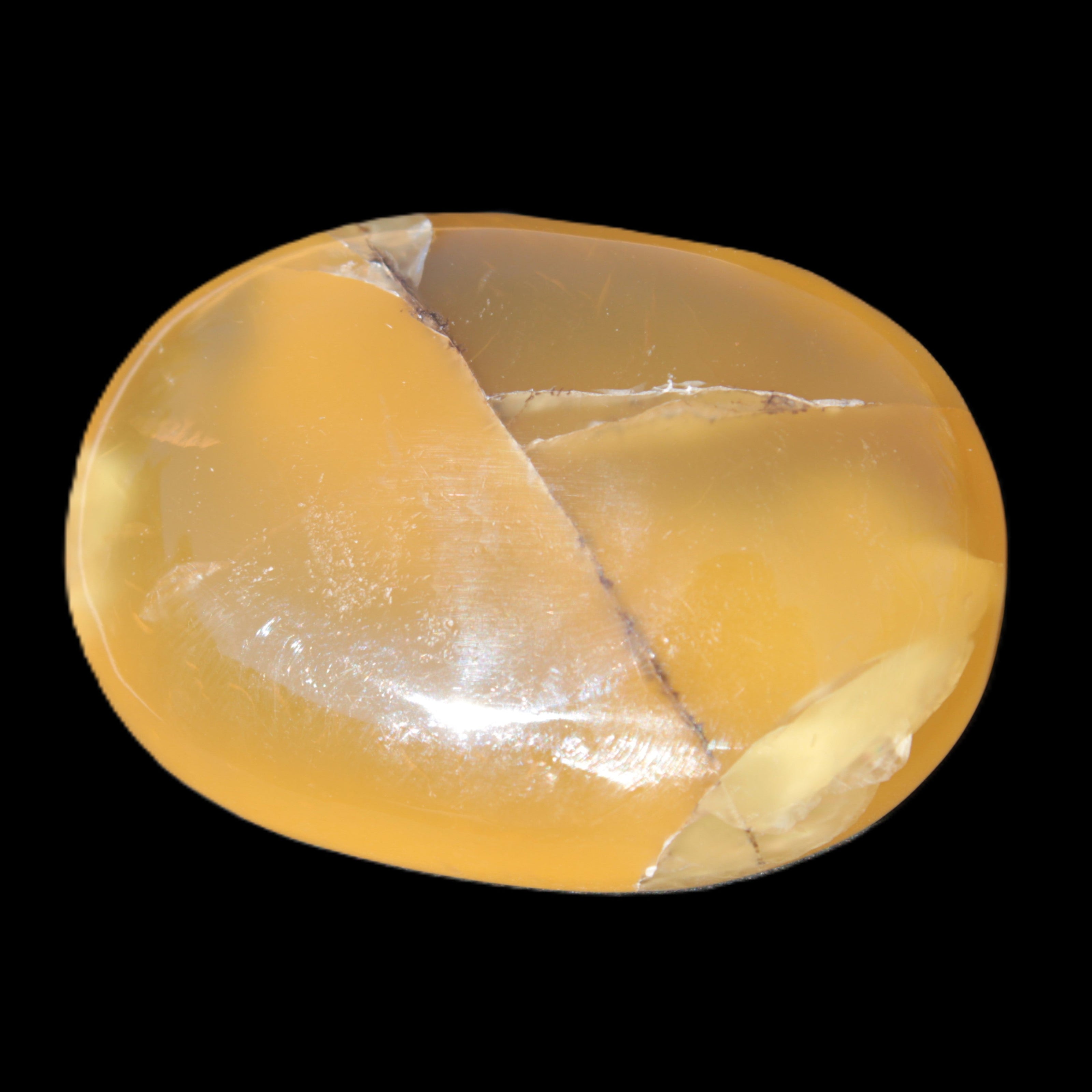 Honey Calcite palm stone 58-62mm 83-95g in sunlight - Rocks and Things Store