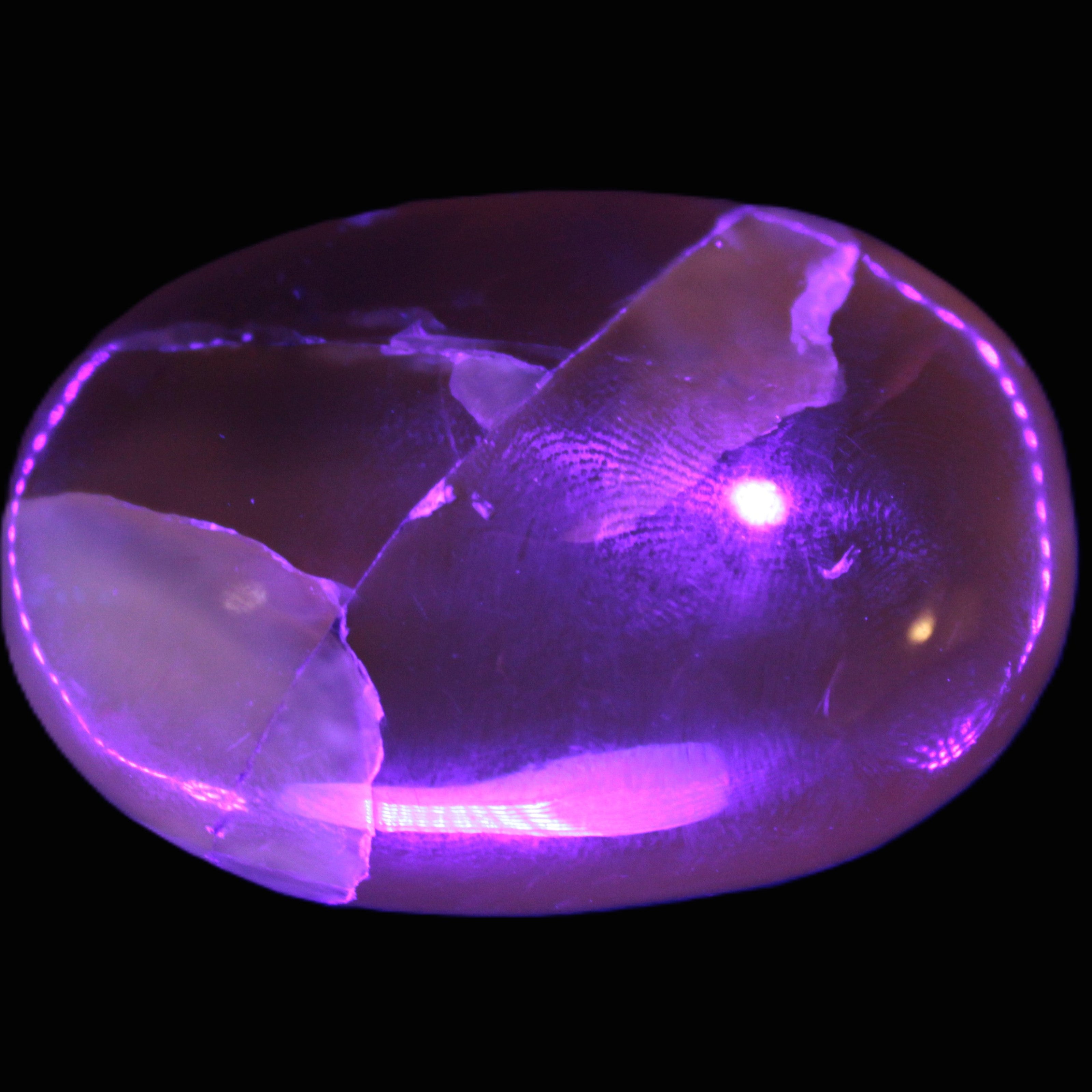 Honey Calcite palm stone 58-62mm 83-95g in UV light - Rocks and Things Store