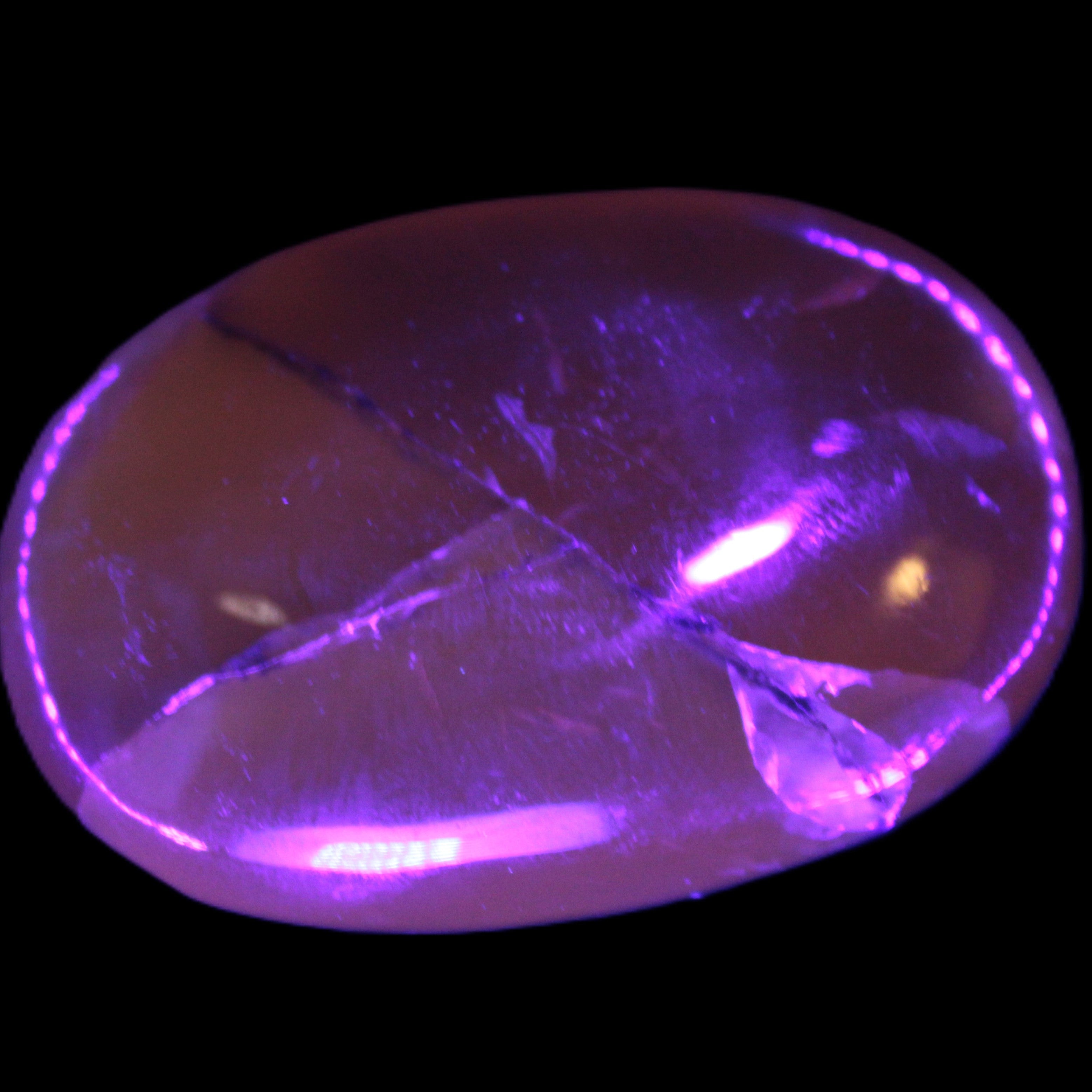 Honey Calcite palm stone 58-62mm 83-95g in UV light - Rocks and Things Store