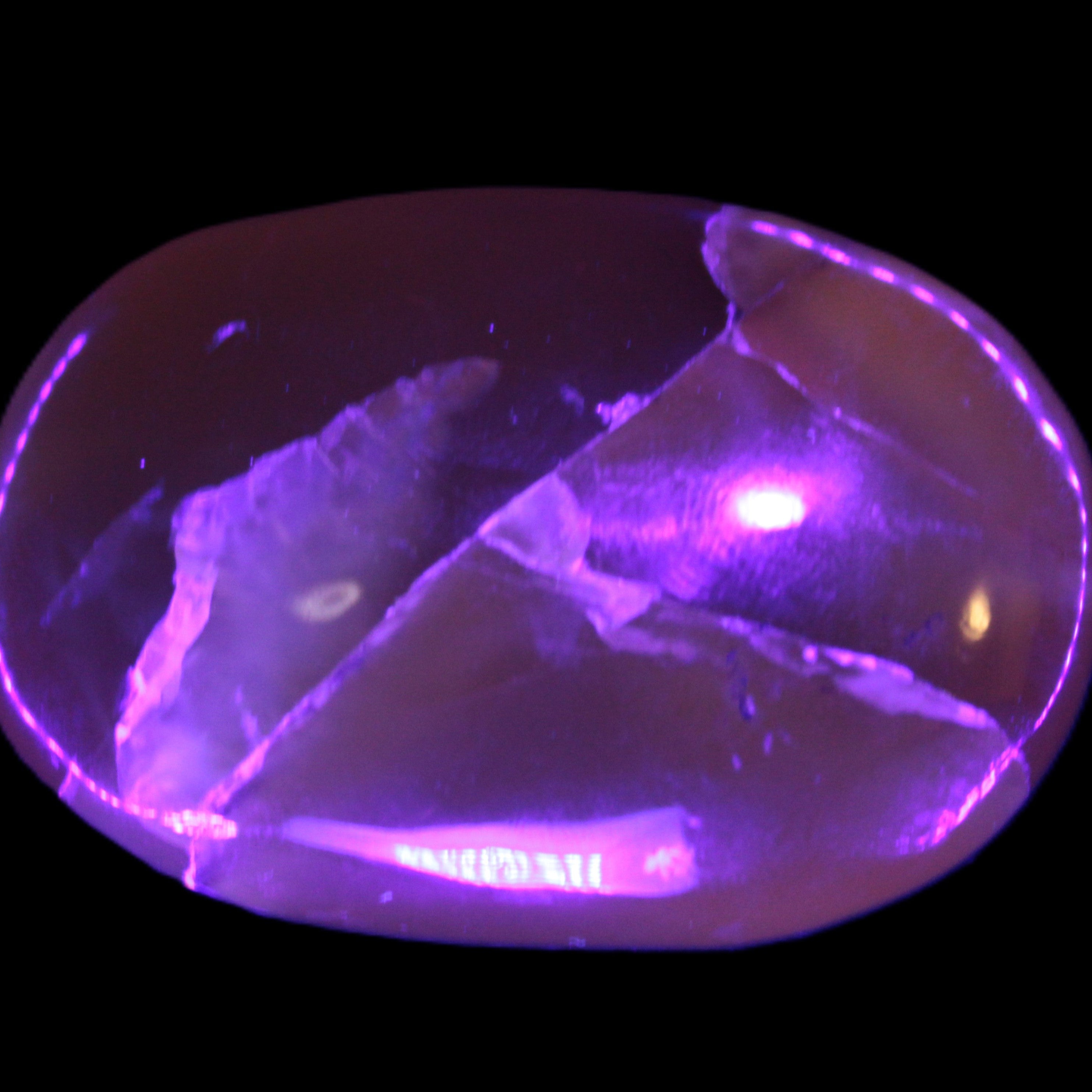 Honey Calcite palm stone 58-62mm 83-95g in UV light - Rocks and Things Store