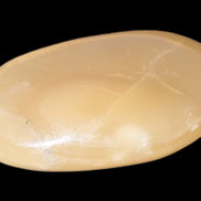 Honey Calcite palm stone 58-62mm 83-95g Rocks and Things