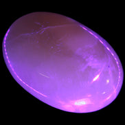 Honey Calcite palm stone 58-62mm 83-95g in UV light - Rocks and Things Store