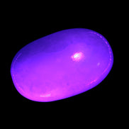 White Jade palm stone from Pakistan 62-72mm 63-86.7g in UV light