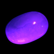 White Jade palm stone from Pakistan 62-72mm 63-86.7g in UV light.7g Rocks and Things