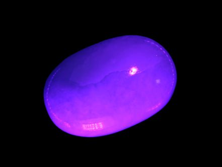 White Jade palm stone from Pakistan 62-72mm 63-86.7g in UV light.7g Rocks and Things
