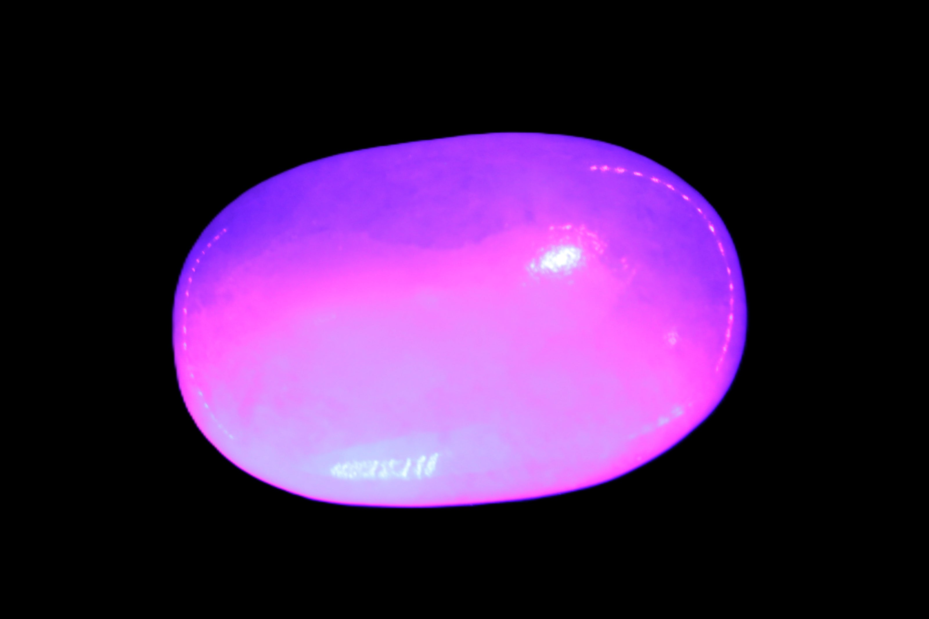 White Jade palm stone from Pakistan 62-72mm 63-86.7g in UV light