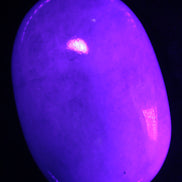 White Jade palm stone from Pakistan 62-72mm 63-86.7g in UV light - Rocks and Things Store