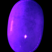 White Jade palm stone from Pakistan 62-72mm 63-86.7g in UV light - Rocks and Things Store