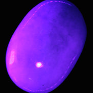 White Jade palm stone from Pakistan 62-72mm 63-86.7g in UV light - Rocks and Things Store